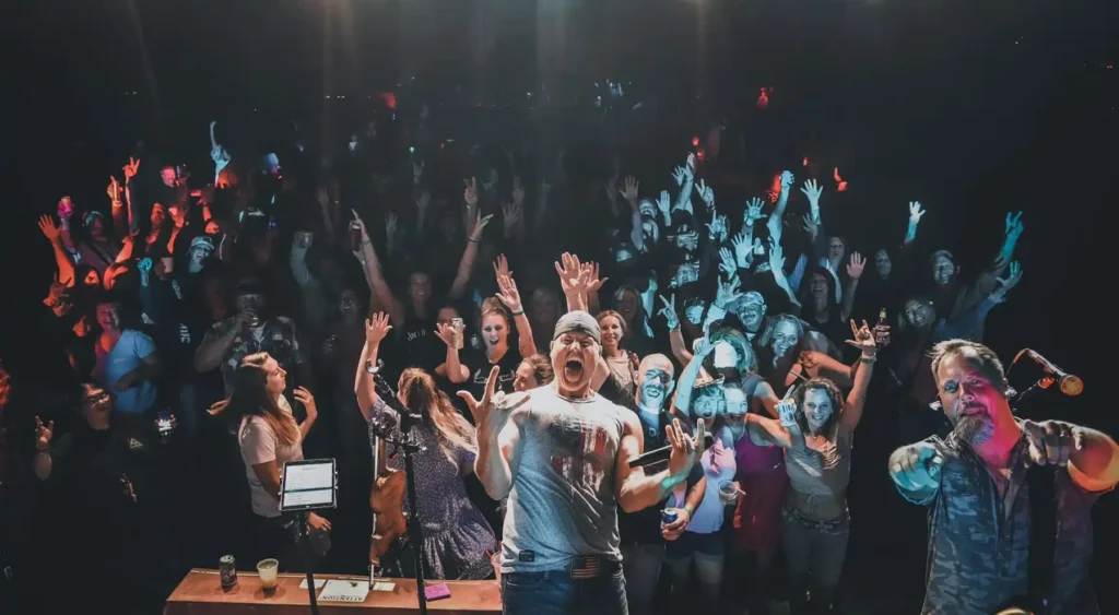 Chris Higbee performing in front of live crowd.