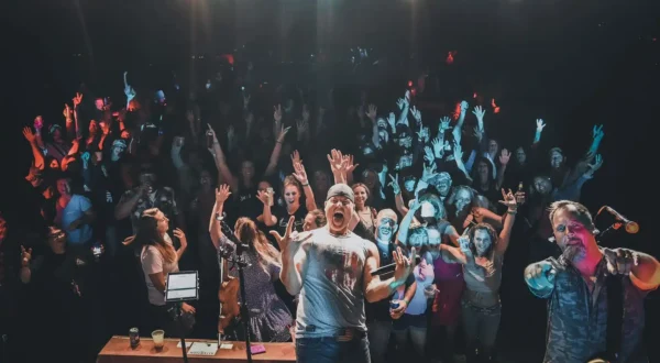 Chris Higbee performing in front of live crowd.