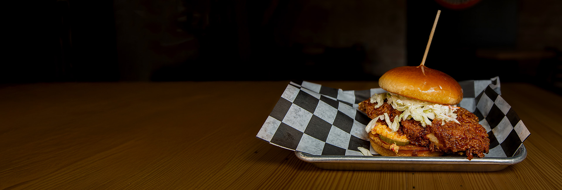 Hot honey chicken sandwich on a platter.