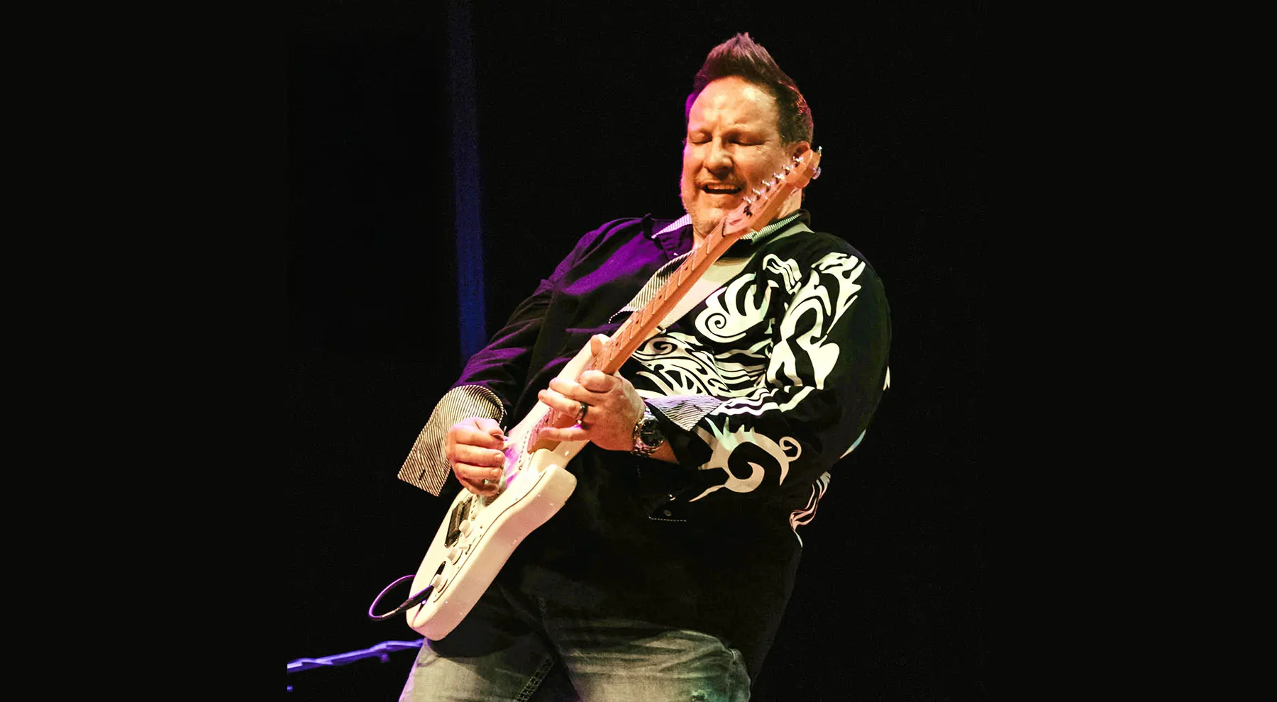 Rajma playing guitar.